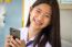 Portrait Of Thai Student Teen Beautiful Girl Using Her Phone And Smile