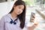 Portrait Of Thai Student Teen Beautiful Girl Using Her Smart Phone Selfie In School