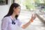 Portrait Of Thai Student Teen Beautiful Girl Using Her Phone And Smile