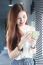 Portrait Of Thai Adult Beautiful Girl Using Her Smart Phone And Smile