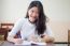 Portrait Of Thai Teen Beautiful Girl Writing Book