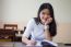 Portrait Of Thai Teen Beautiful Girl Writing Book