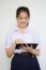 Portrait Of Thai High School Student Uniform Beautiful Girl Using Her Tablet