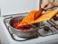 Woman Cooks Carrots And Beets