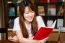 Portrait Of Thai Adult Student University Uniform Beautiful Girl Reading Red Book