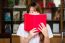 Portrait Of Thai Adult Student University Uniform Beautiful Girl Reading Red Book