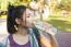 Portrait Of Young Beautiful Woman In Sport Wearing Drinking Wate