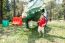 The Boy Is Walking Around Dinosaur Statue