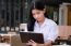 Portrait Of Thai High School Student Uniform Beautiful Girl Using Her Tablet