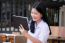 Portrait Of Thai High School Student Uniform Beautiful Girl Using Her Tablet