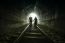 Couple Walking Together Through A Railway Tunnel