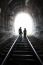 Couple Walking Together Through A Railway Tunnel