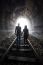 Couple Walking Together Through A Railway Tunnel