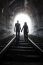 Couple Walking Together Through A Railway Tunnel