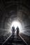 Couple Walking Together Through A Railway Tunnel