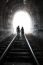 Couple Walking Together Through A Railway Tunnel