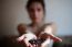 Woman With Coffee Cup On Ceramic Table And Mobile Phone