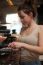 Brunette In Kitchen With Coffee Maker