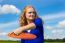 Young Dutch Woman Throwing Orange Frisbee