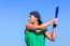 Young Woman With Baseball Bat And Cap