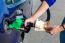 Woman Fueling Car Tank And Holding Euro Money