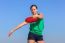 Dutch Woman Throwing Orange Disc In Sky