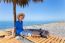 Dutch Boy Sitting Under Parasol On Portuguese Beach