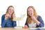 Two Female Students Exploring Jaw Model With Teeth In Biology