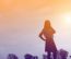 Silhouette Of Woman Praying Over Beautiful Sky Background