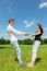 Young Attractive Couple Holding Each Other In Sunny Meadow