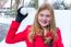 Young Dutch Woman Dressed In Red Holding Snowball