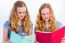 Two Teenage Girls Reading School Books