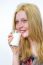 Blond Girl Drinking Glass Of Milk