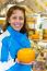 Woman Showing Round Cheese