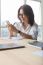 Office Table Scene Of Asian Working Woman Reading Message On Mobile Phone For Modern Life Connecting