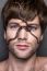 Portrait Of A Young Handsome Man With Snake On His Face