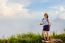 Tourist Teen Girl Poses On Mountain