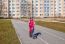 Little Girl In A Safety Helmet Riding A Bicycle