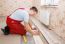 Man Laying Laminate Flooring