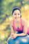 Healthy Woman - Girl Smiling And Leaning Fitness Ball, Blurred Bokeh Abstract Light Spring Forest Background