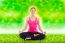 Beautiful Young Woman Practicing Yoga, Sitting In A Lotus Position