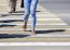 Young Woman Crossing A Street In The City