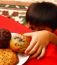 Kid Taking Cake From Table