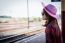 Girl Tourist Sitting On A Bench In A Train Station