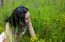 Young Woman Lying On The Grass