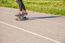 Young Woman Skateboarding In The Park