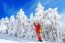 Young Woman Taking Photo With Smartphone On Mountains In Winter