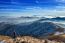 Young Woman Hiker Taking Photo With Camera On Mountains Peak In Winter