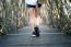 Woman Walking On Wooden Bridge. Vintage Tone