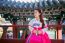 Woman With Hanbok In Gyeongbokgung,the Traditional Korean Dress